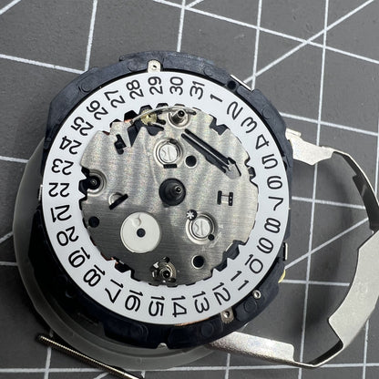 Hattori Epson TMI YM26A quartz watch movement, Japan-made, precise and reliable for watch repairs.