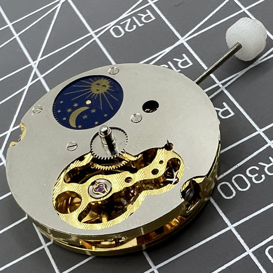 Skeleton dial Generic 8205 mechanical watch with star phase and small seconds at 5 o?clock.