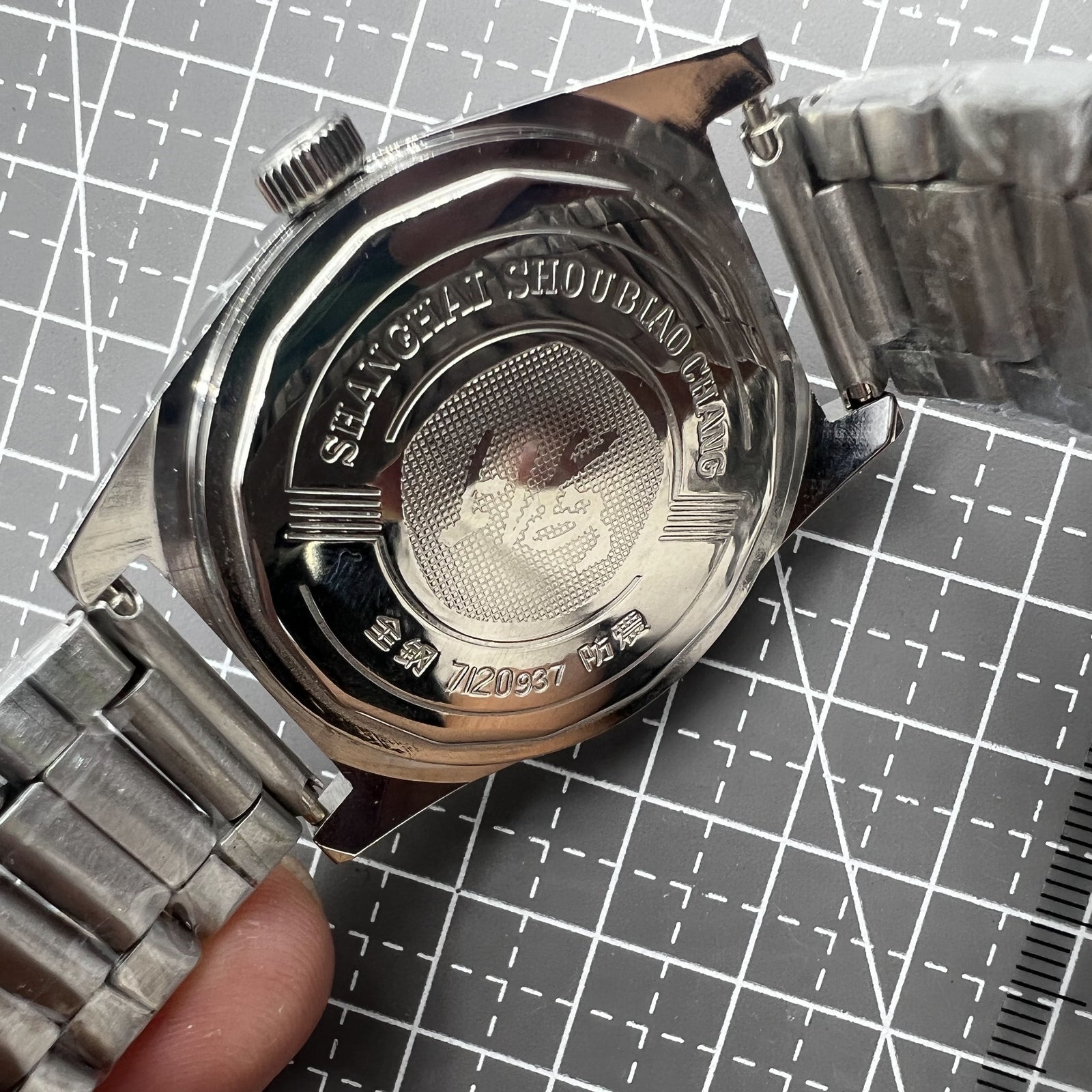 Shanghai 38mm manual mechanical watch with white dial, three hands, and stainless steel case by Shanghai brand.