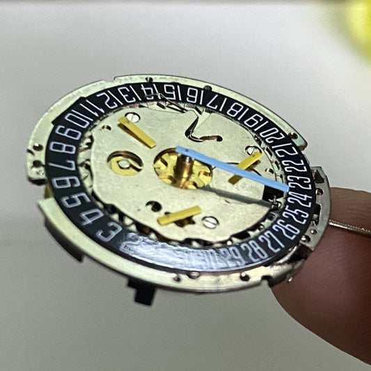 ISA8171 Swiss Silver watch with ISA 8161 quartz movement, date at 6, black dial, and six hands.