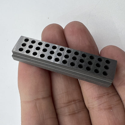 Bergeon 1902 steel staking block for precise riveting in watch accessories and repairs.