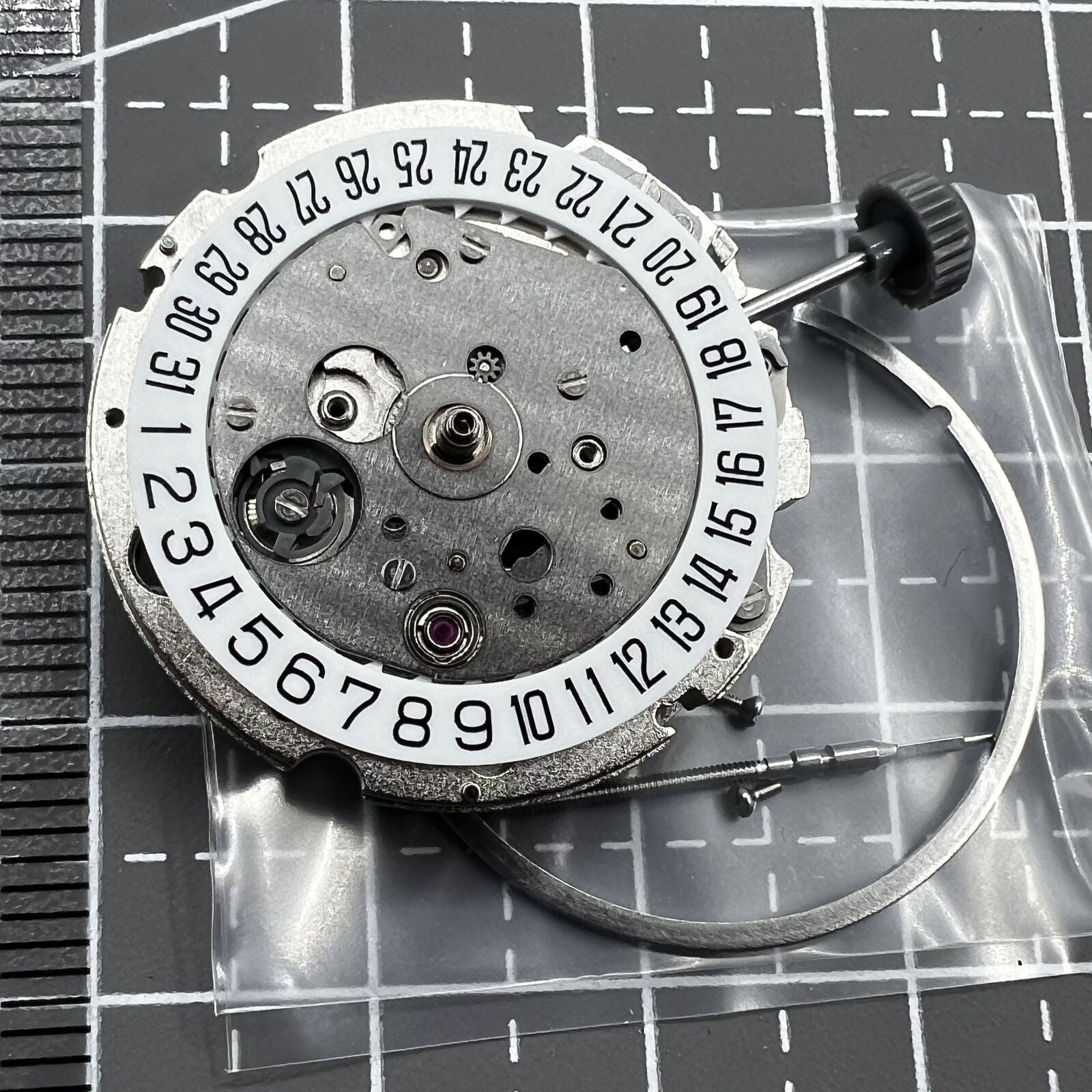 Miyota/Citizen 8215 automatic watch movement with white dial, date at 6 o'clock, perfect for watch repairs.