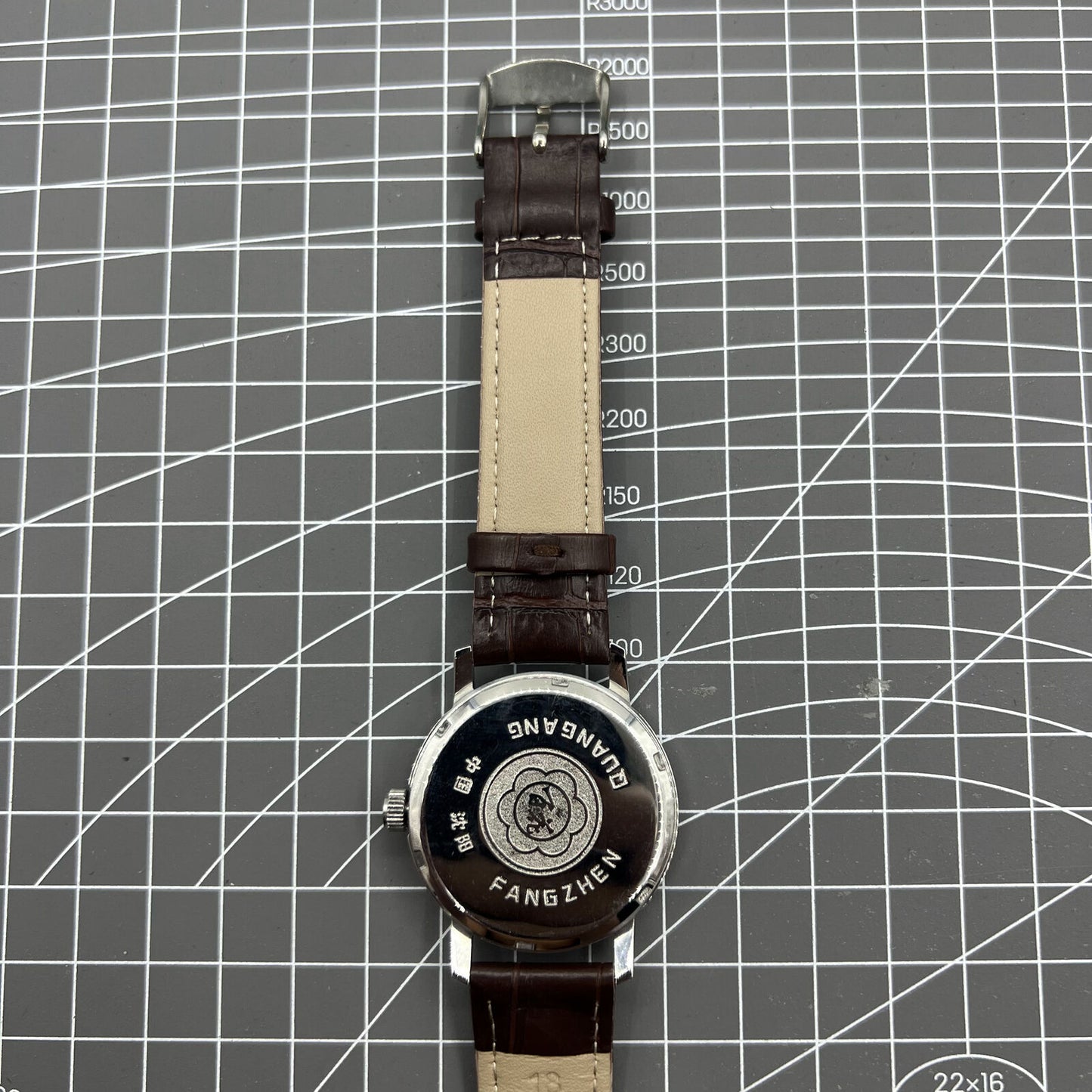 China Baihua 37mm manual watch with silver dial, 19 jewels, shock-resistant mechanical movement.