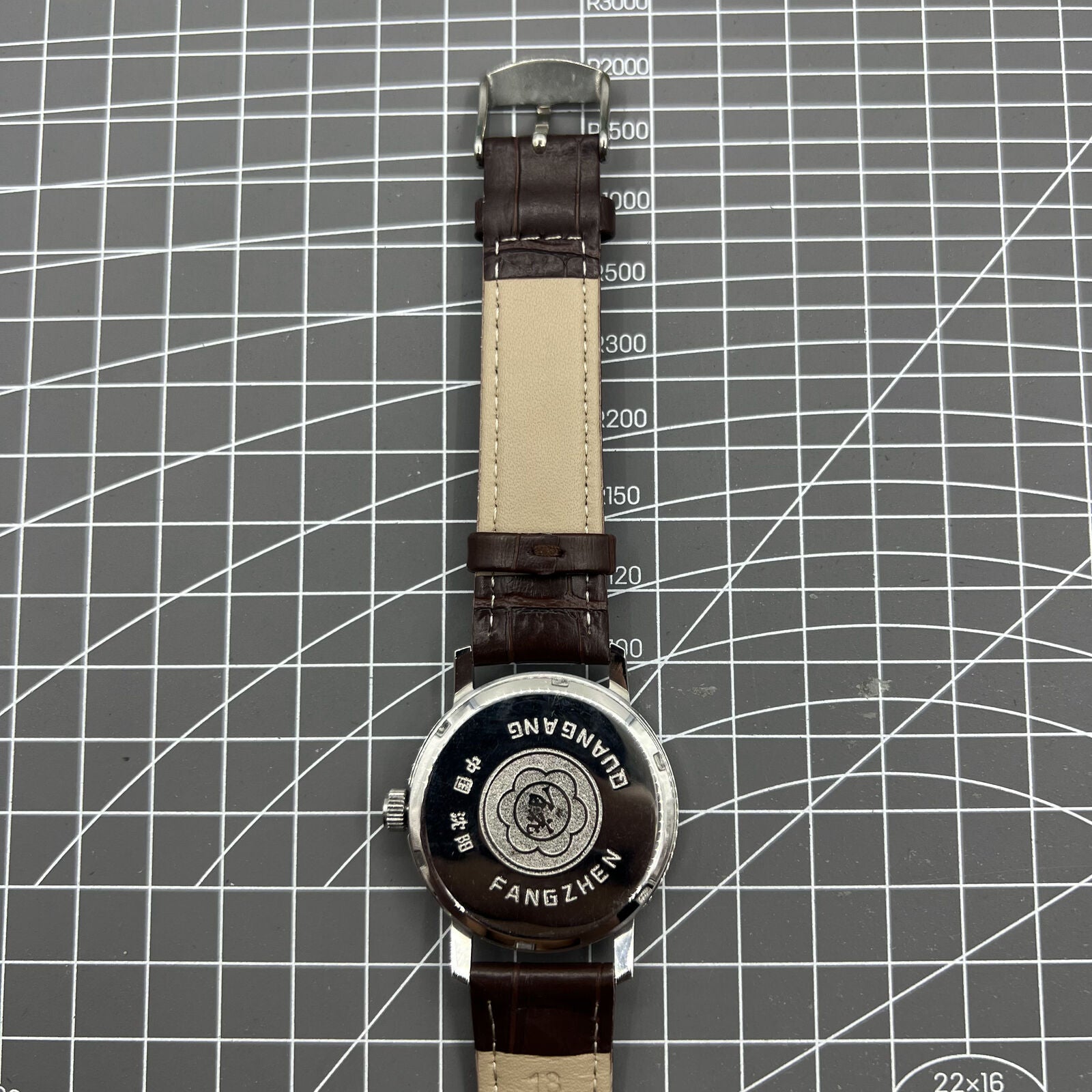 China Baihua 37mm manual watch with silver dial, 19 jewels, shock-resistant mechanical movement.