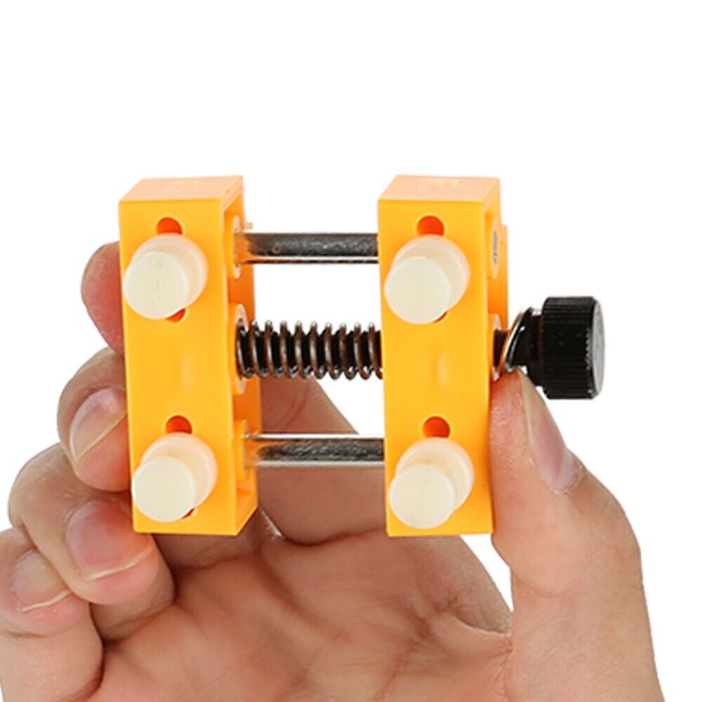 Adjustable watch back case opener tool with fixing holder for precise cover removal.
