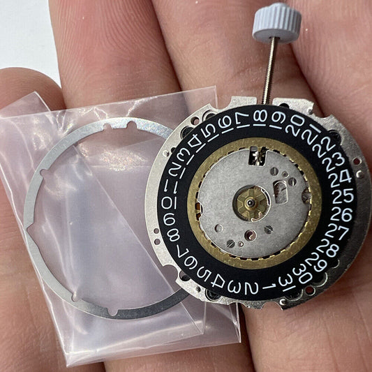 Ronda 705 Swiss quartz watch movement with black date wheel, date display at 3 o?clock for precise timekeeping.