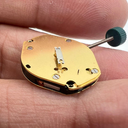 Ronda 1069 golden plated quartz watch movement, Swiss made, precision timekeeping component.