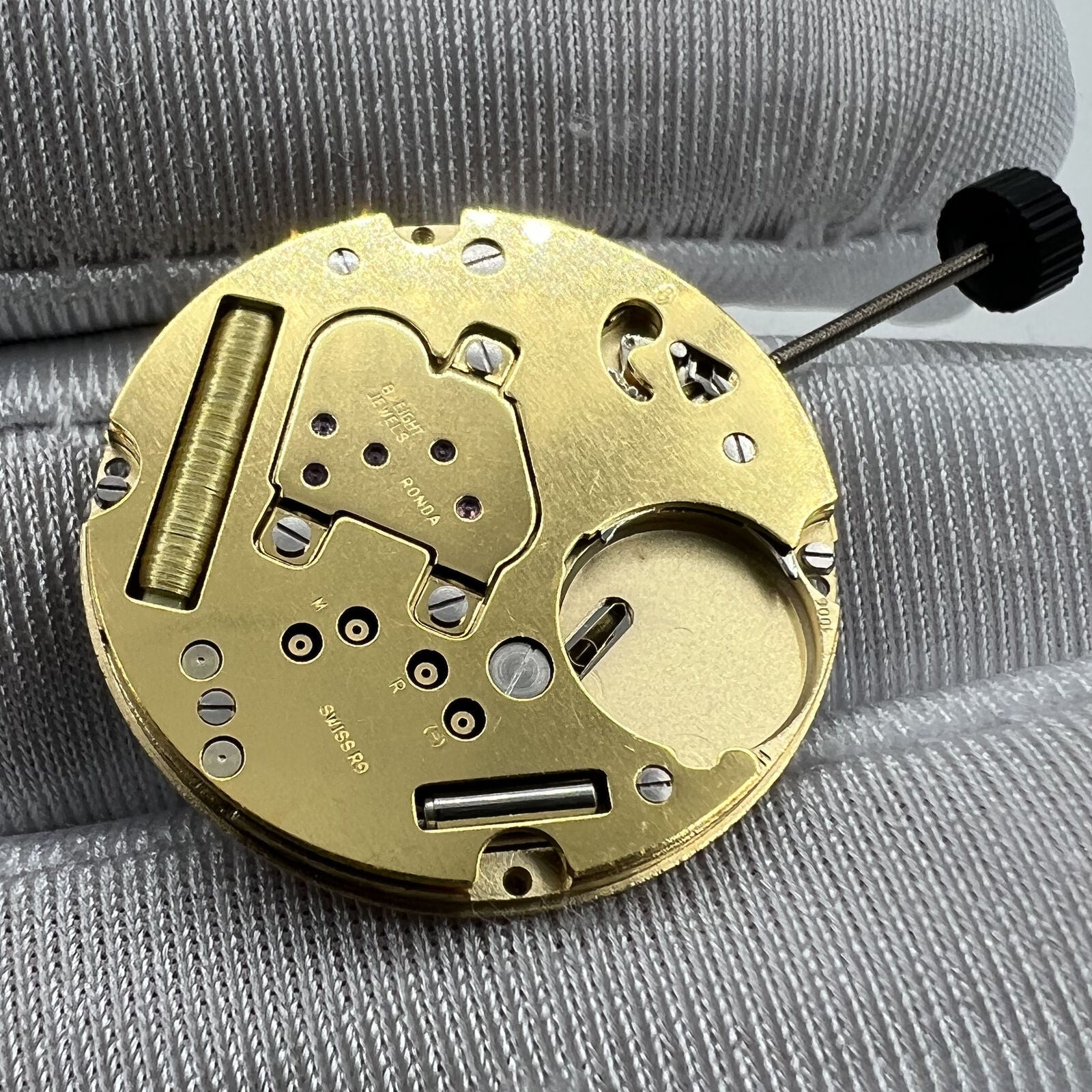 Swiss Movement Ronda 1006 Slimtech quartz watch mechanism showcasing precise timekeeping in premium accessories.