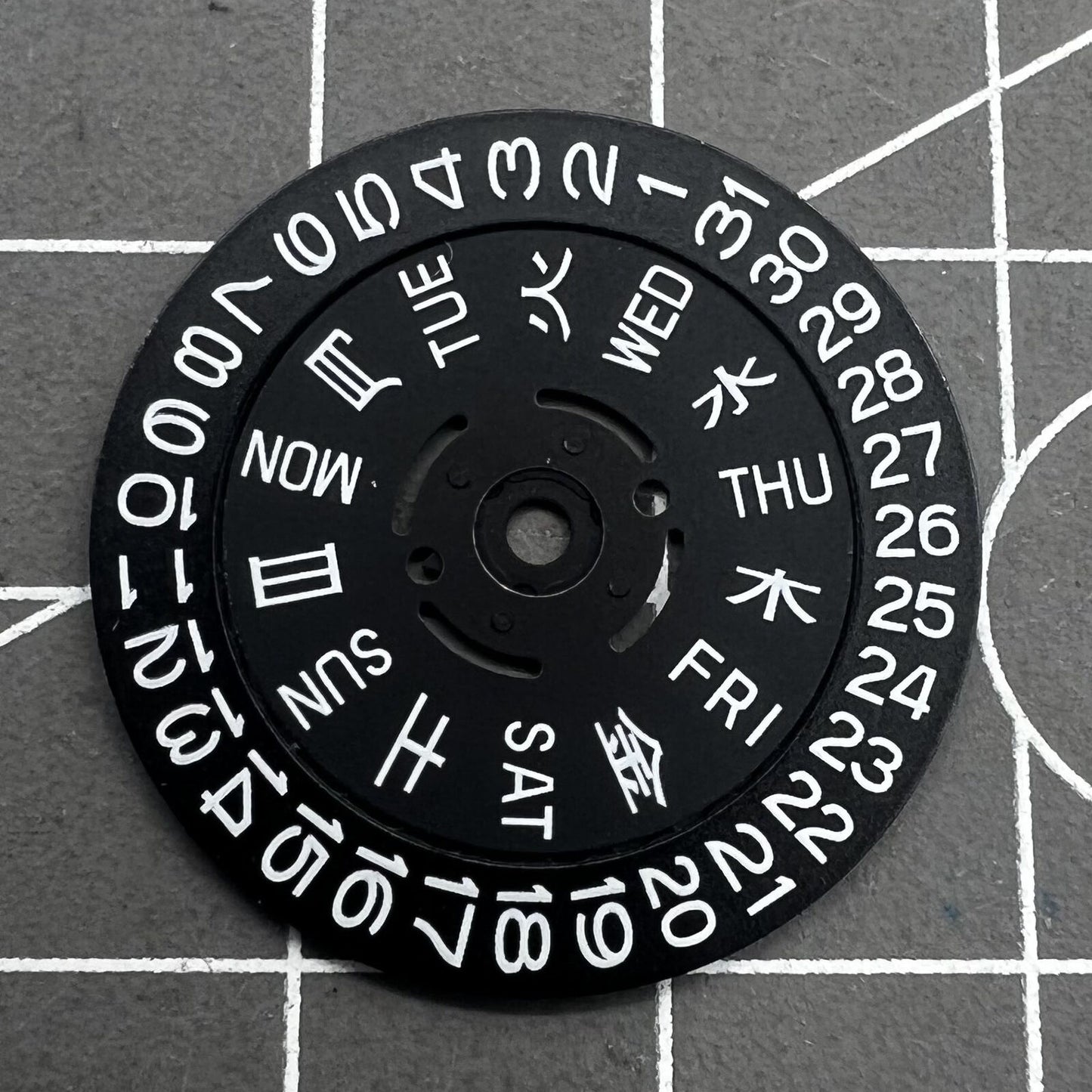 Green lume date and week wheels for NH36 movement, showing date at 3.8, precision watch accessory.
