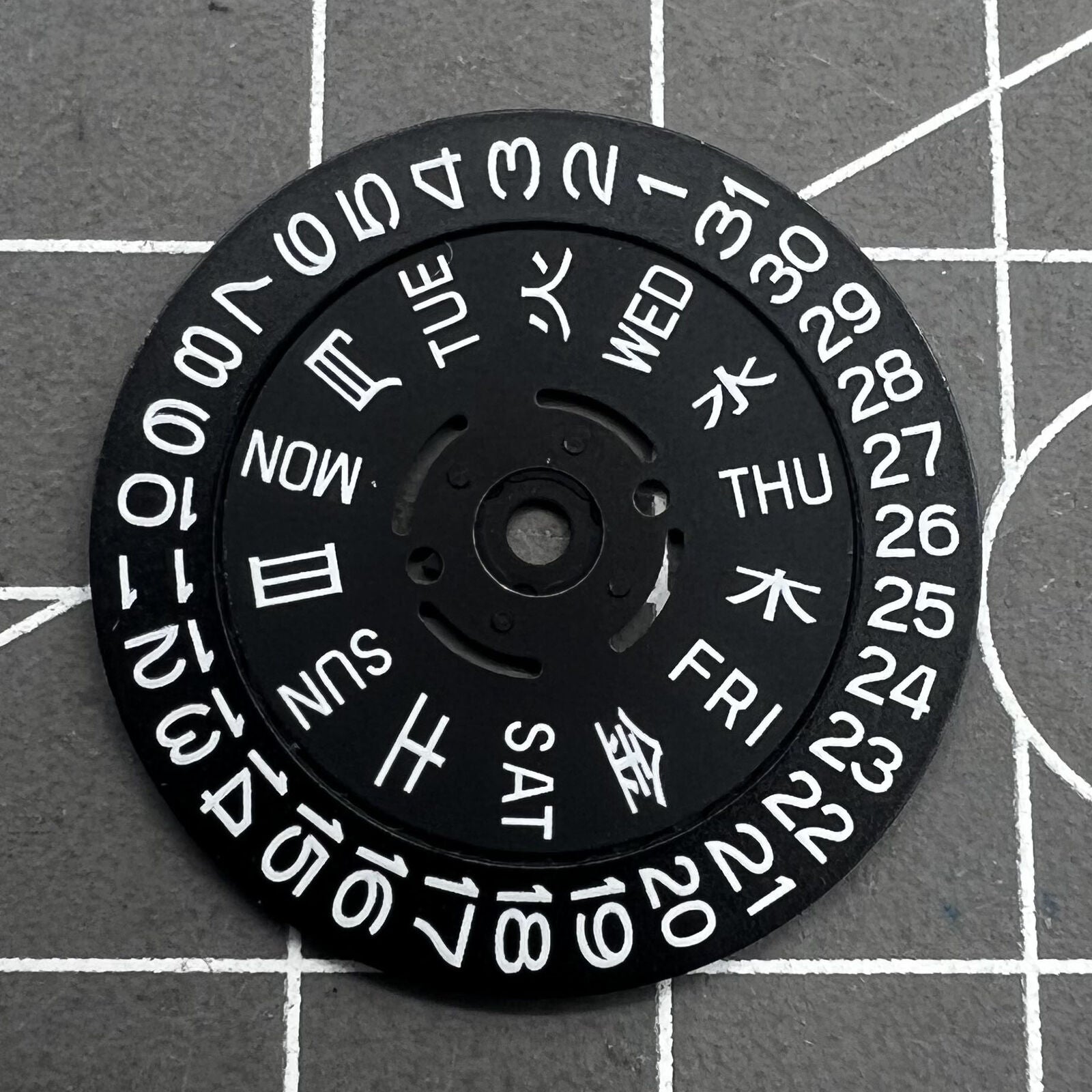 Green lume date and week wheels for NH36 movement, showing date at 3.8, precision watch accessory.