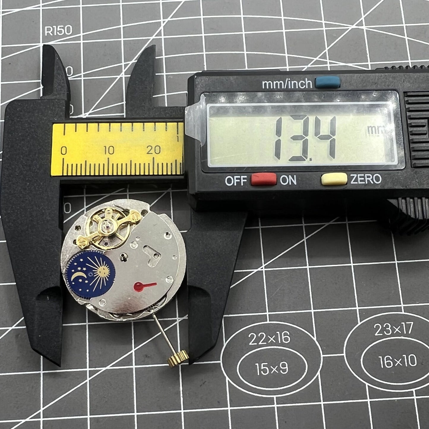 7120 Automatic watch featuring moon phase at 6 o'clock and exposed balance wheel.