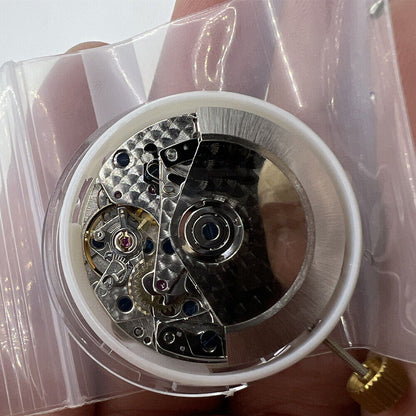 Asian 7750 chronograph movement with white dial, single calendar at 4:30, and seconds subdial at 9, branded for precise timekeeping.