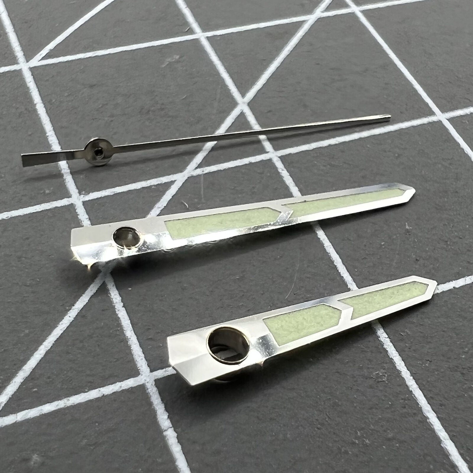 Green luminous watch hands designed for China Made 8215/2813/Miyota 8N24 movement, enhancing visibility.