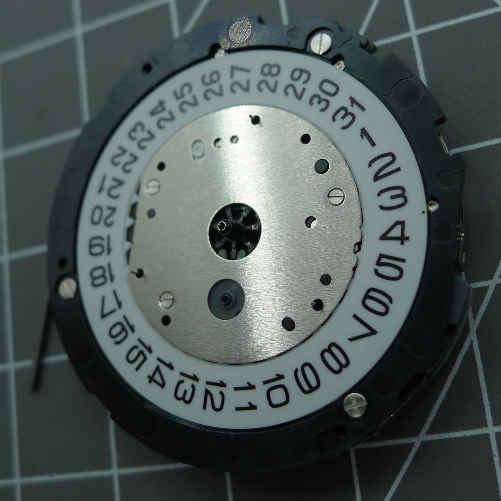 Japan Made Miyota 6S30 quartz watch movement with date at 4 and small seconds subdials.