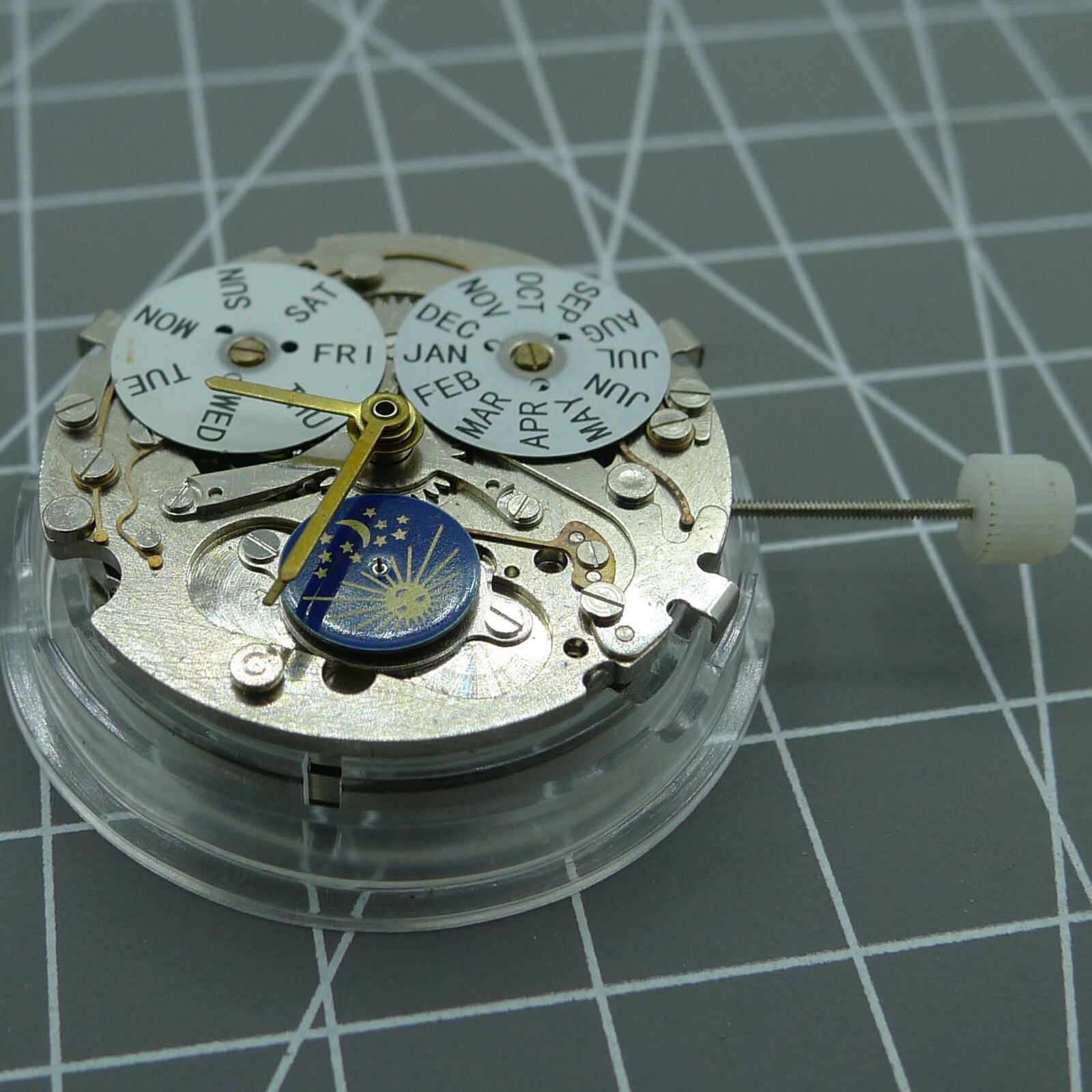 Automatic mechanical watch with silver case, week and month display at 12, moon phase at 6.