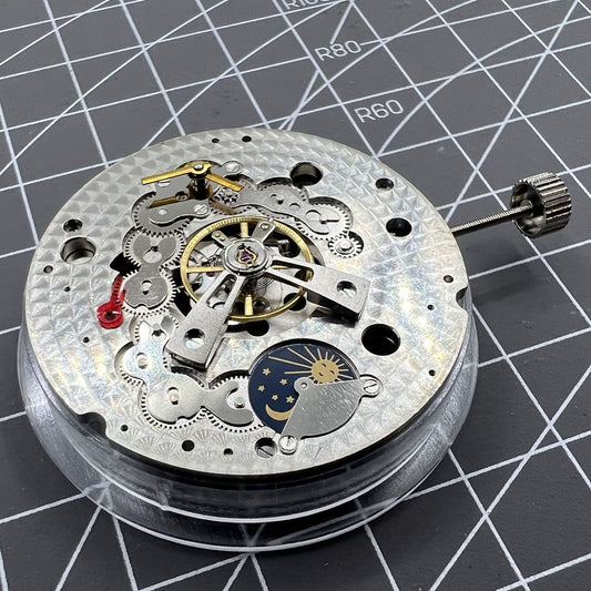 Dandong Silver watch with hollow star moon phase, automatic mechanical movement, elegant watch accessory.