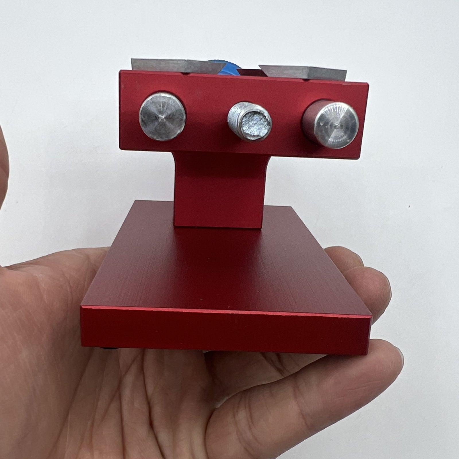 Professional watch bezel remover and case back opener tool for precise watch repair workbench.