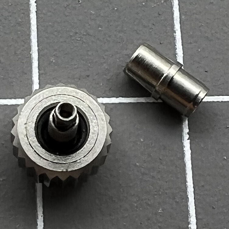 Polished 6.3mm silver OMEGA Seamaster 300 watch crown with tube, precision replacement accessory.