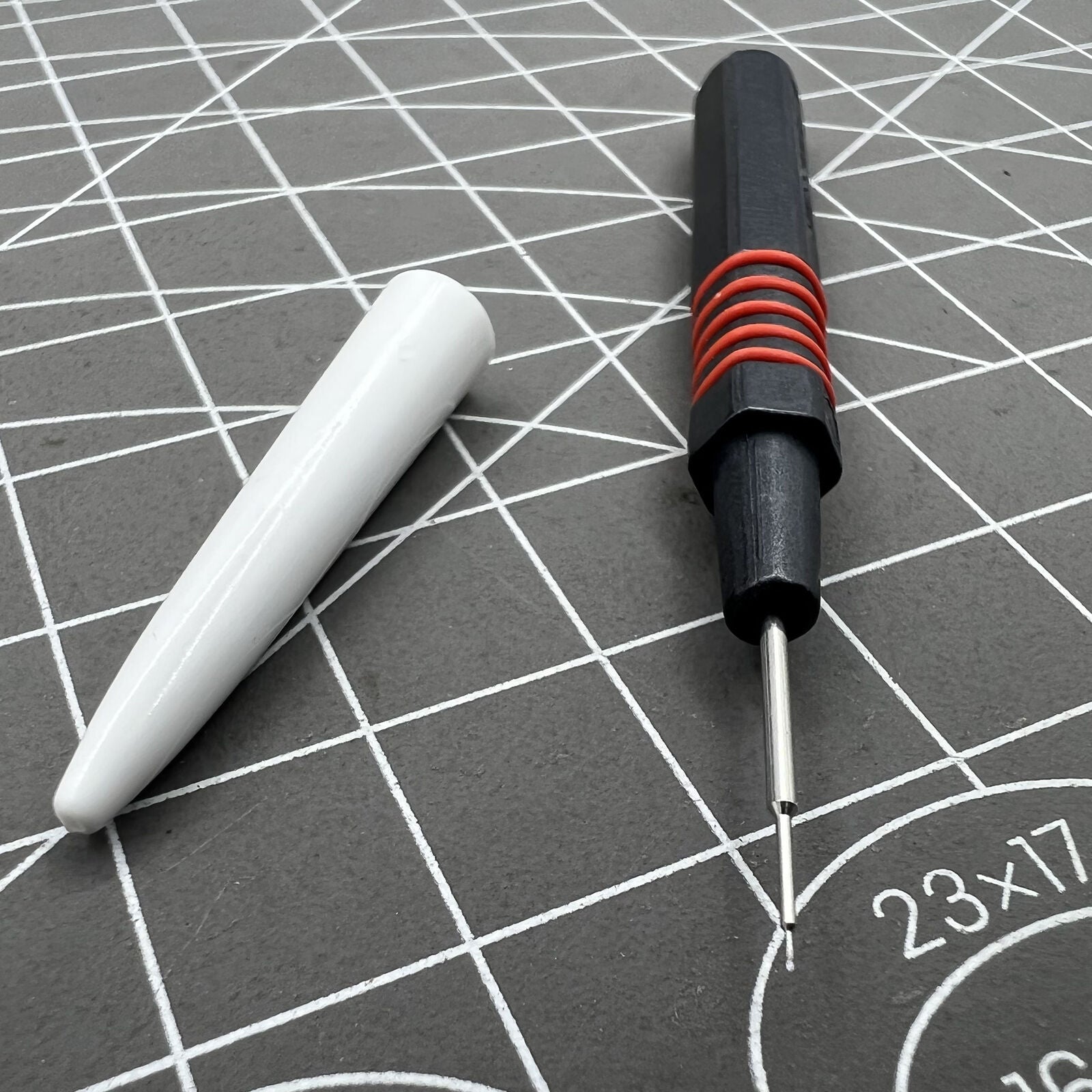 Swiss Bergeon 7013-R red metal dip oiler designed for precise watch grease application by watchmakers.