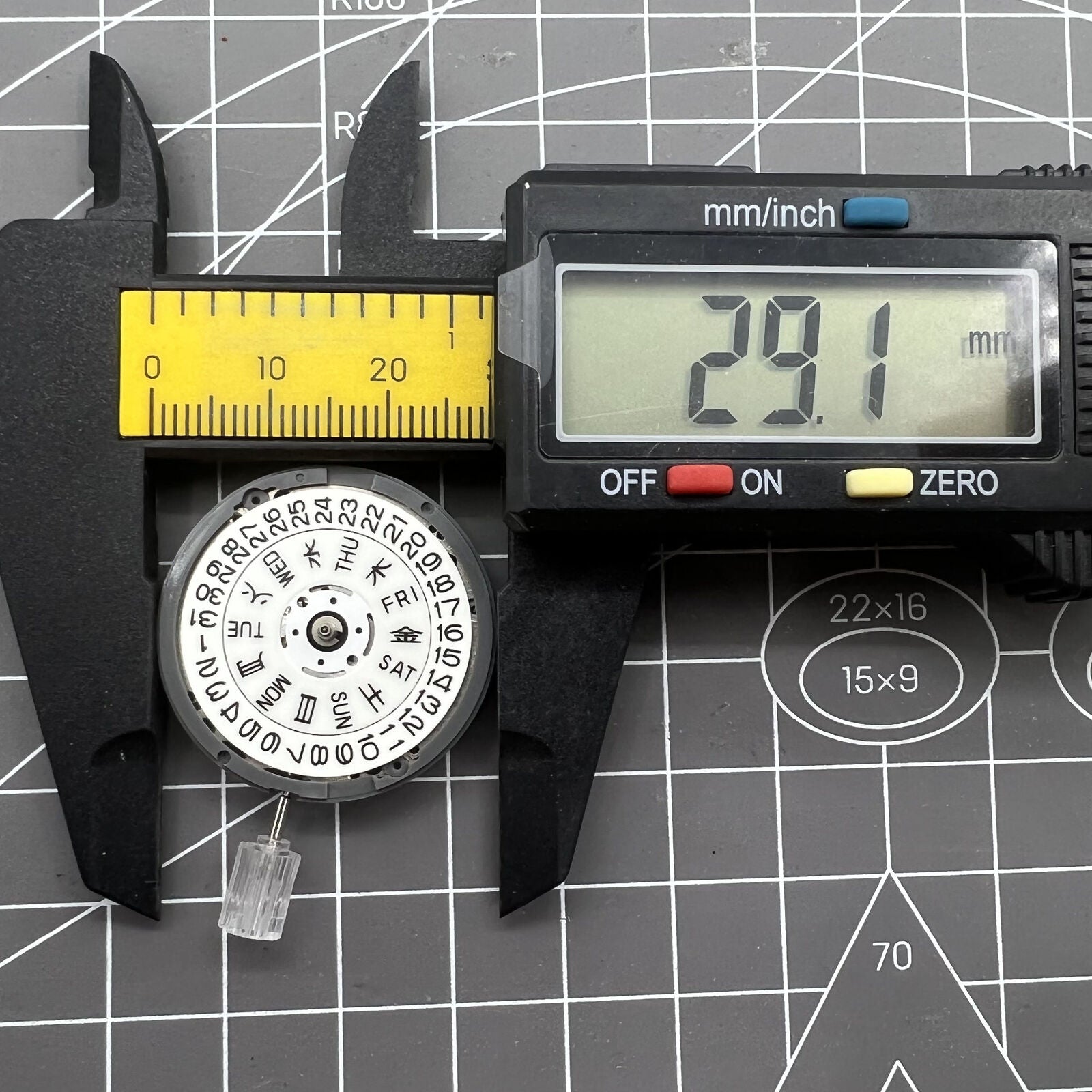 Seiko NH36A watch movement with white dial and blue lume, featuring 3/3.8 crown positions for precision.