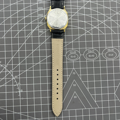 Black Dandong manual mechanical watch with 17 jewels, golden dial, and single calendar for classic elegance.