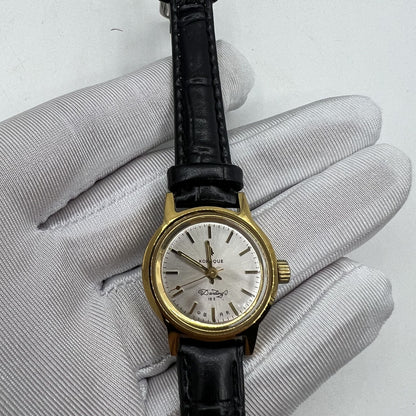 27mm Kongque watch with silver dial, golden markers, 19-jewel manual mechanical movement, China made.
