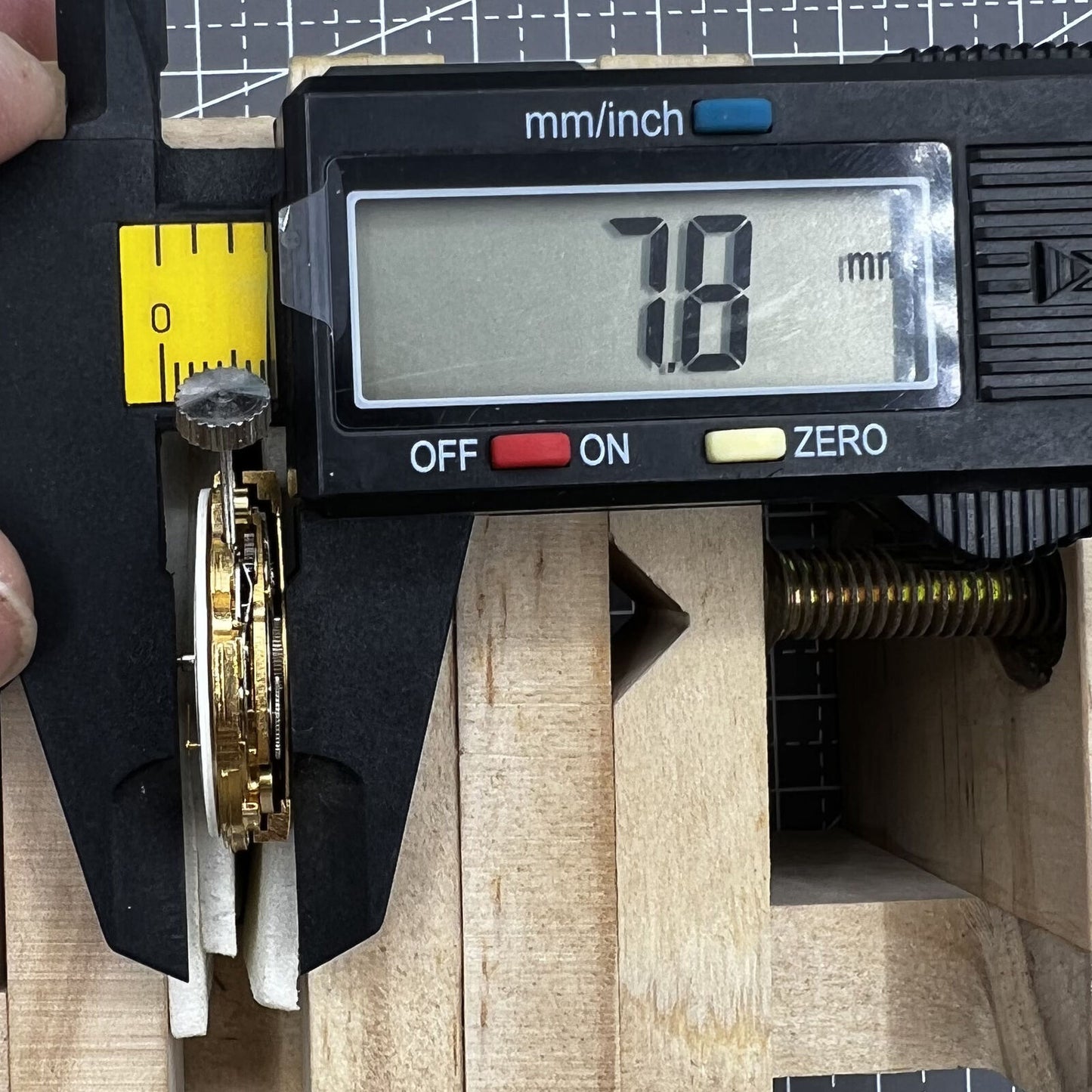 Multifunctional automatic watch with mechanical movement, date display at 2 o'clock, and 24-hour digital dial.