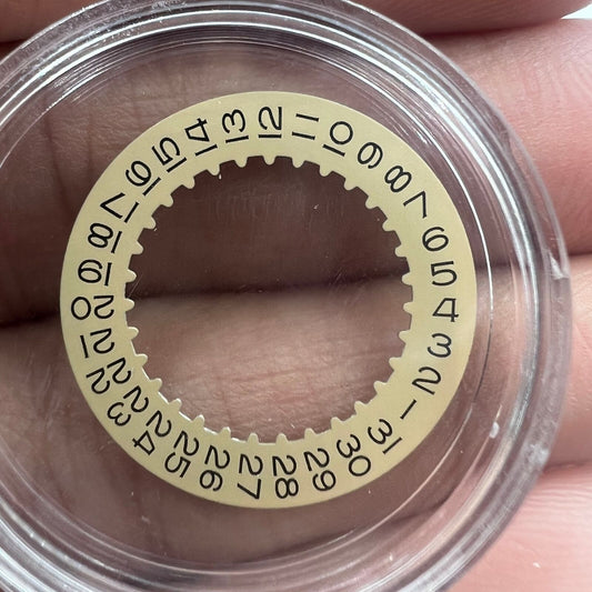 Golden date disk wheel featuring black numbers, compatible with RLX 3135 movement, precision watch accessory.