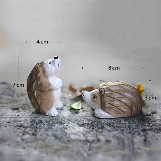 Handcrafted wooden hedgehog figurines set, featuring lying and standing designs for home d�cor.