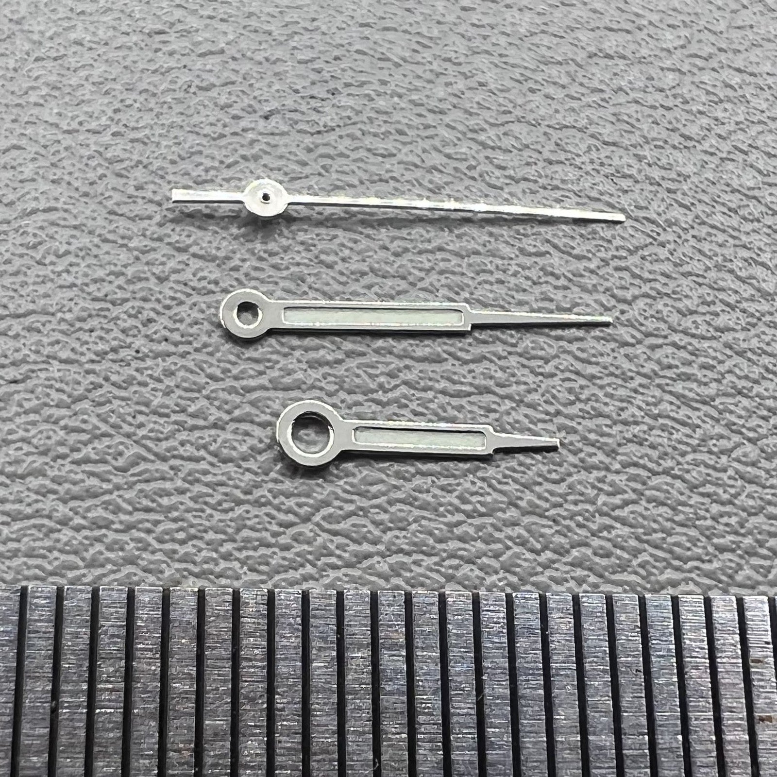 Set of silver trim green lume pointed hands for Ronda 515 watch movement, perfect for precise time reading.