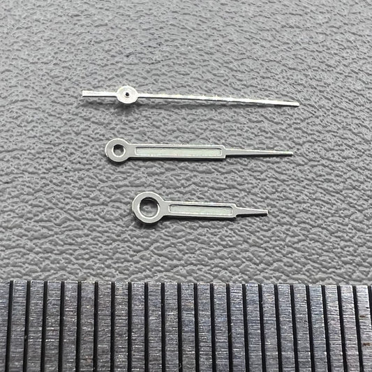 Set of silver trim green lume pointed hands for Ronda 515 watch movement, perfect for precise time reading.