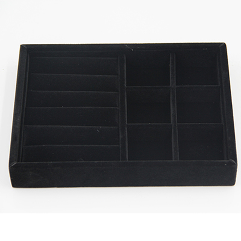 Gray velvet stackable jewelry organizer tray with grid compartments for elegant watch accessory storage.