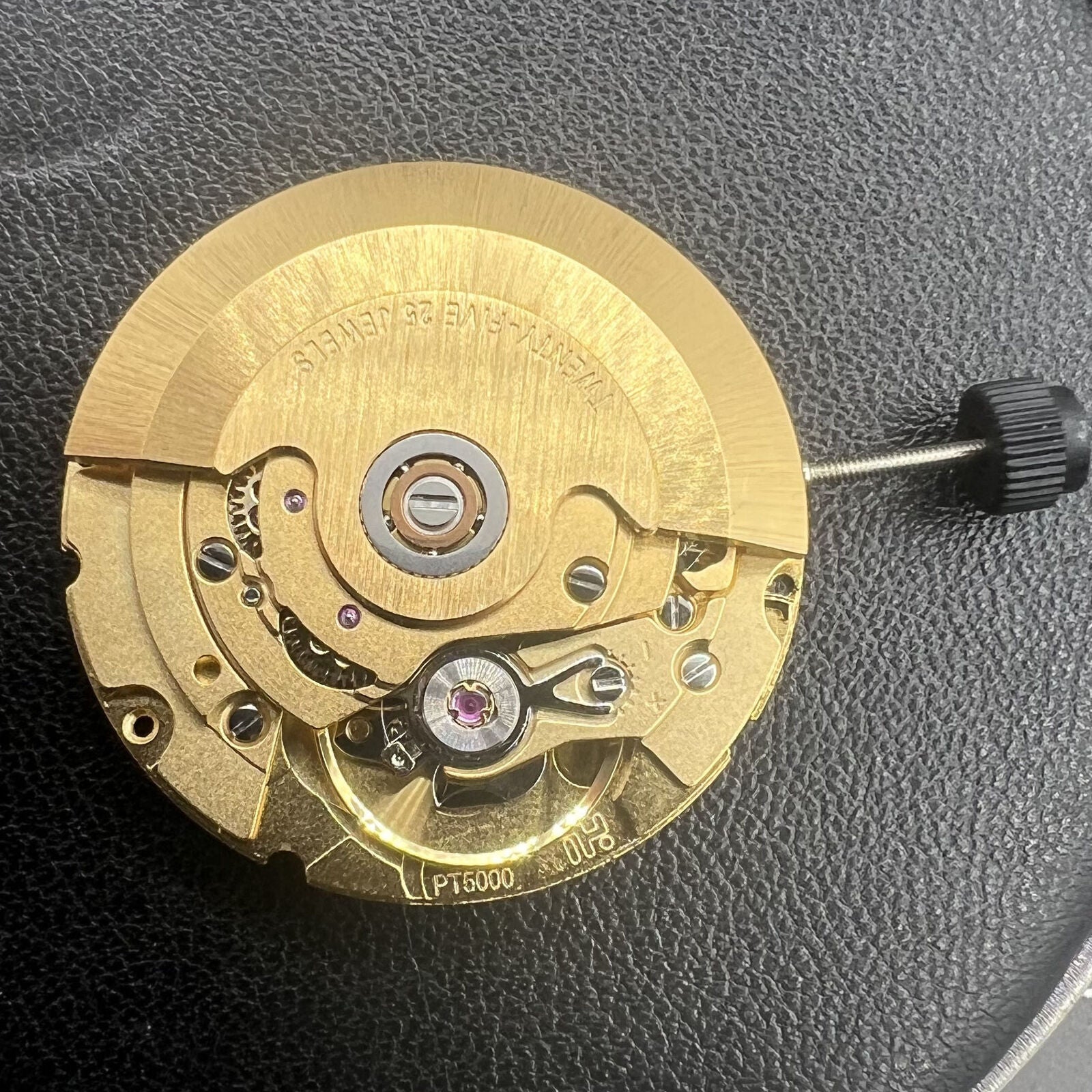 Golden PT5000 automatic watch movement by ETA, ideal for precise mechanical watch repairs.