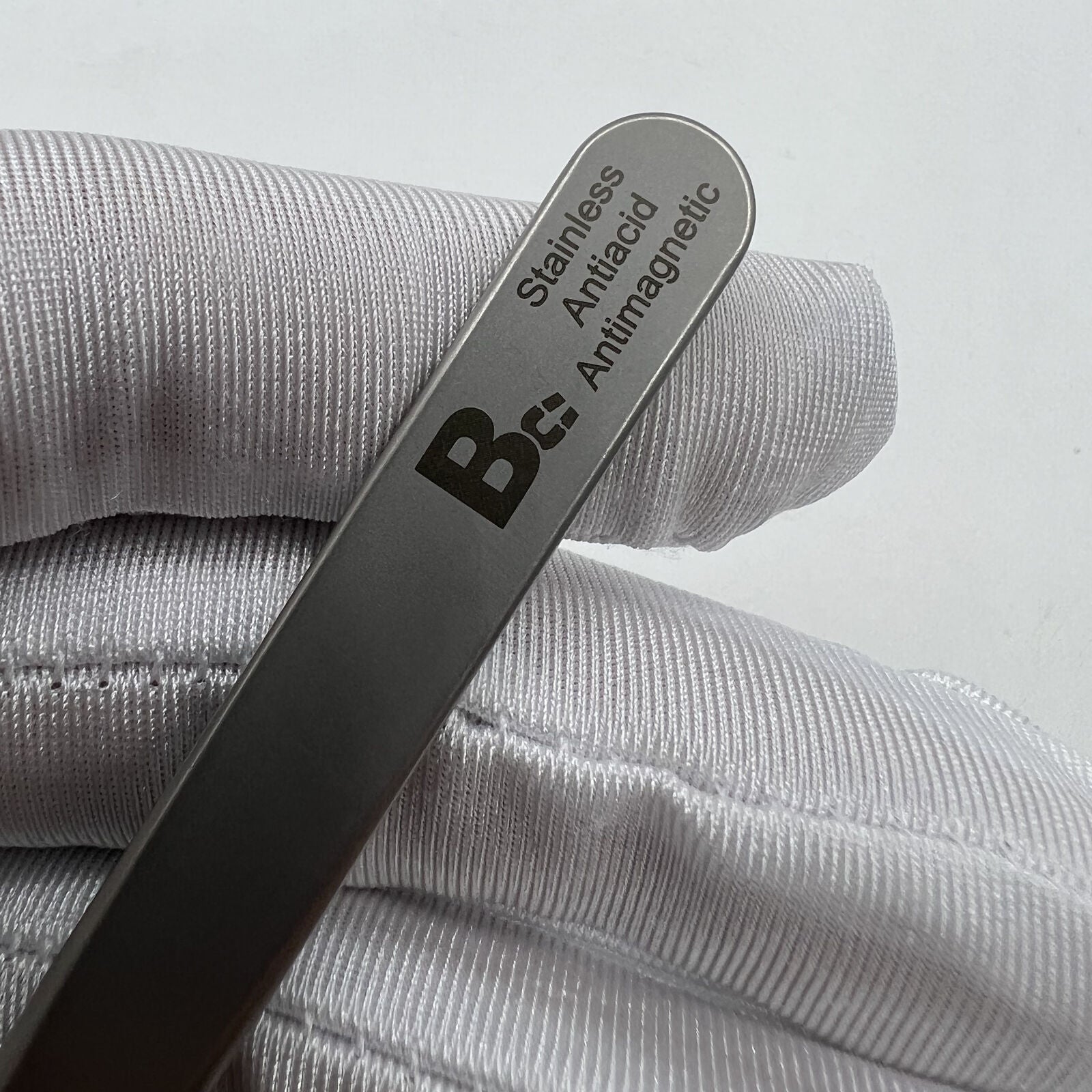 Swiss Bergeon 7026-3 antimagnetic fine hairspring tweezers for precise watch repair and adjustment.