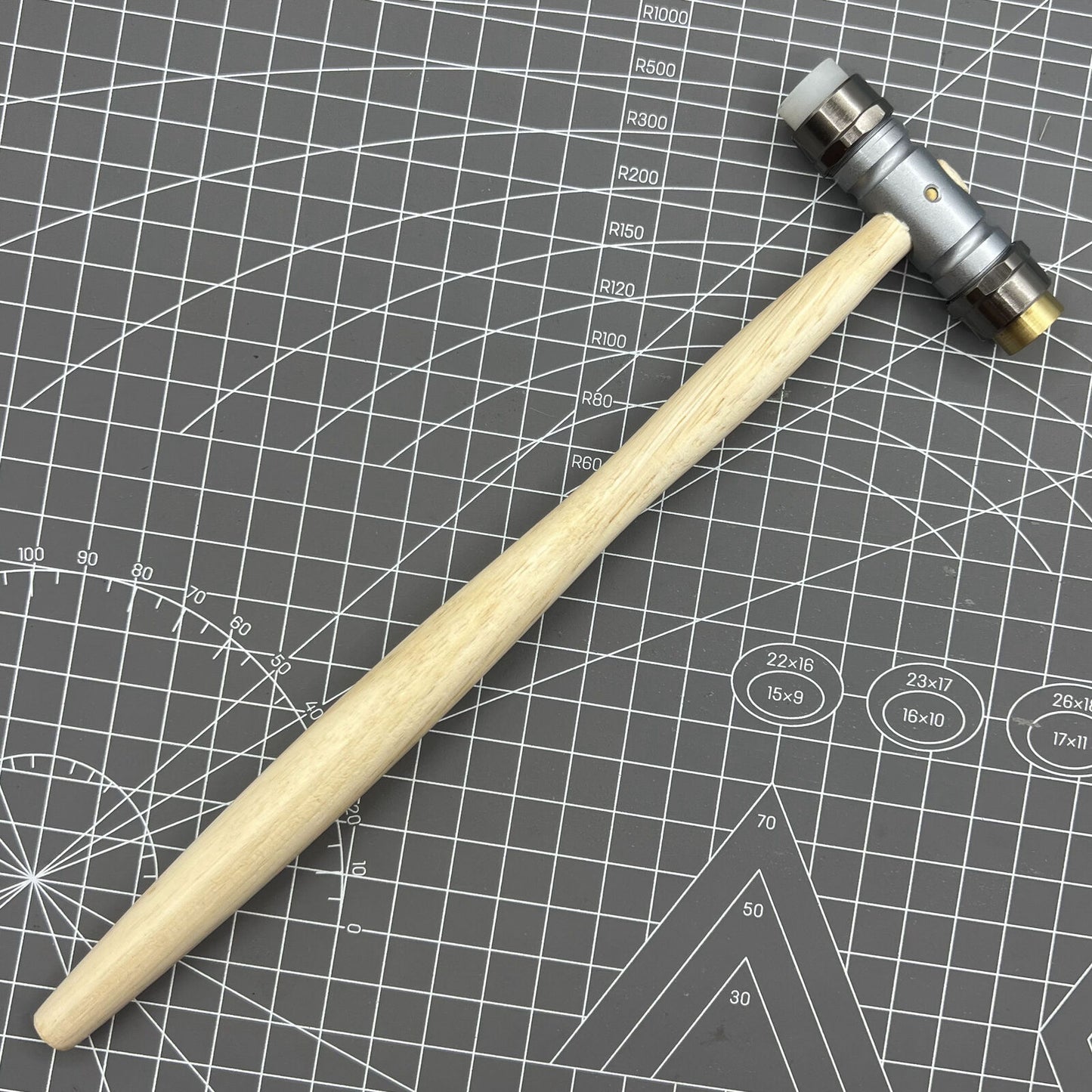 Swiss Bergeon 30417 hammer with replaceable brass and synthetic ends for delicate watch repairs.