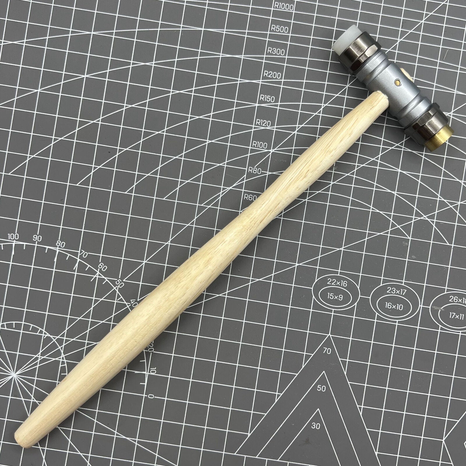 Swiss Bergeon 30417 hammer with replaceable brass and synthetic ends for delicate watch repairs.