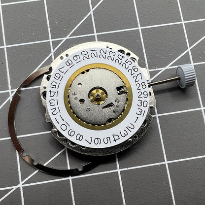 Swiss Made Ronda 705 quartz watch movement with date display at 3 o'clock for precise timekeeping