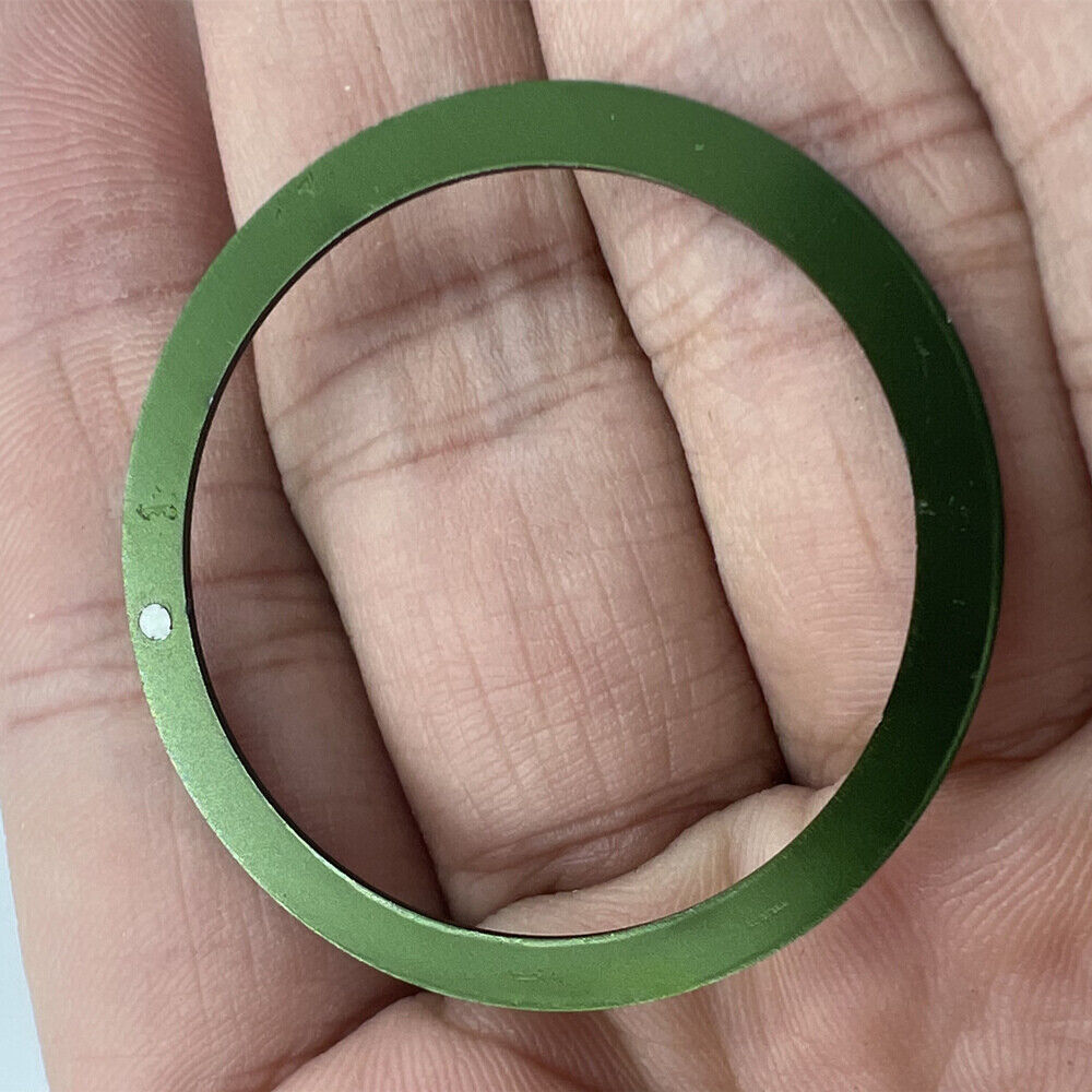 Green aluminum bezel insert for 39mm/32mm watches, boosting style and durability.