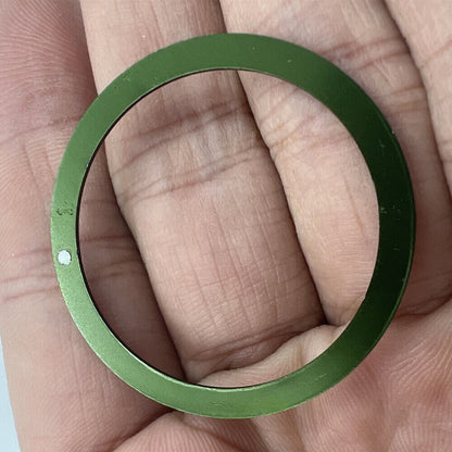 Green aluminum bezel insert for 39mm/32mm watches, boosting style and durability.