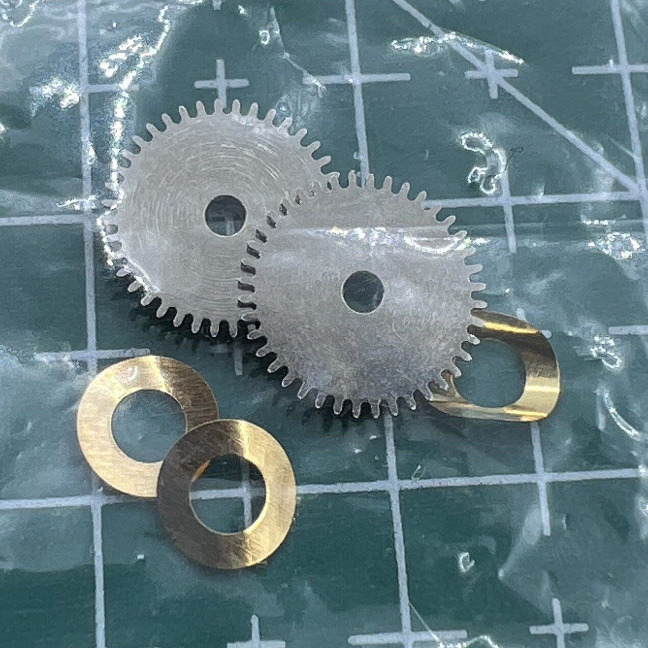 Hour wheel and train bridge compatible with Seagull ST3600 ETA6497 movement for watch repair.