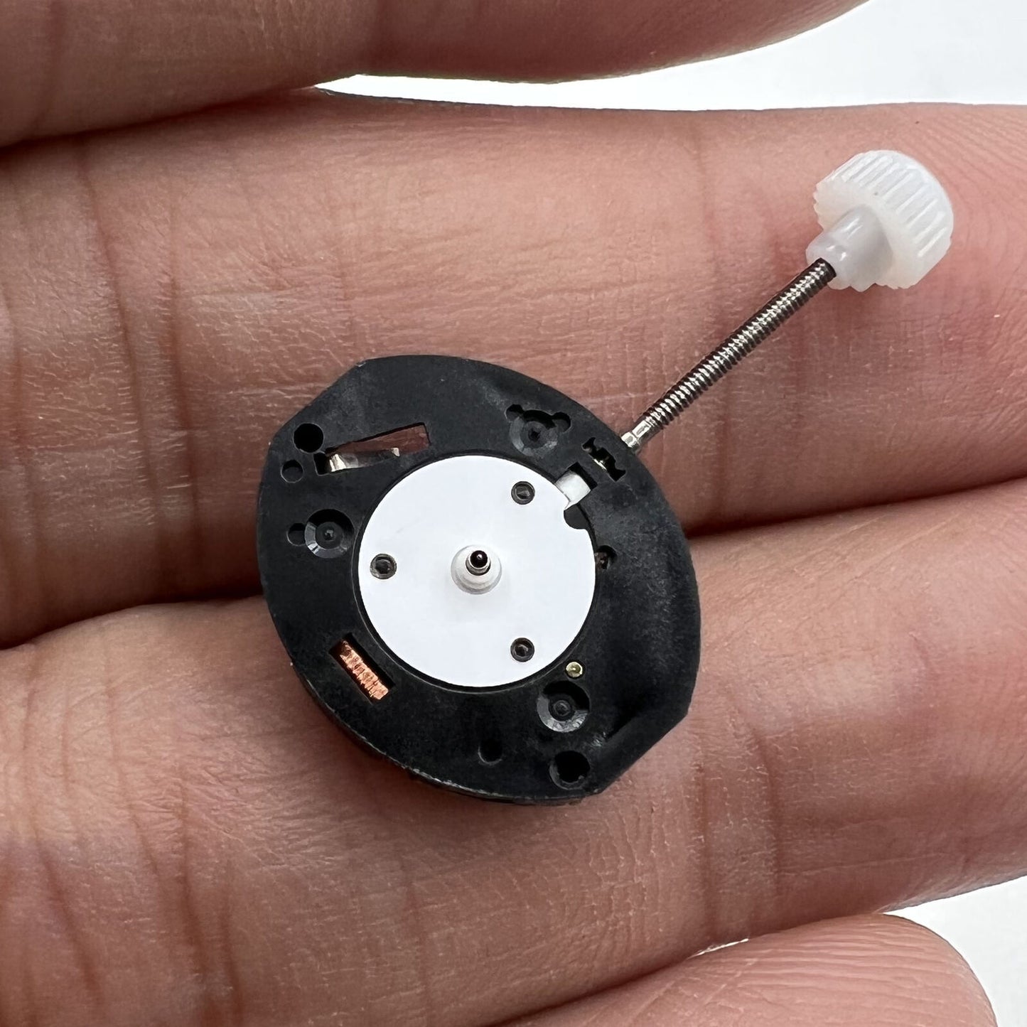 Sunon PE11 quartz watch repair parts showing 3 hands for precise timekeeping.