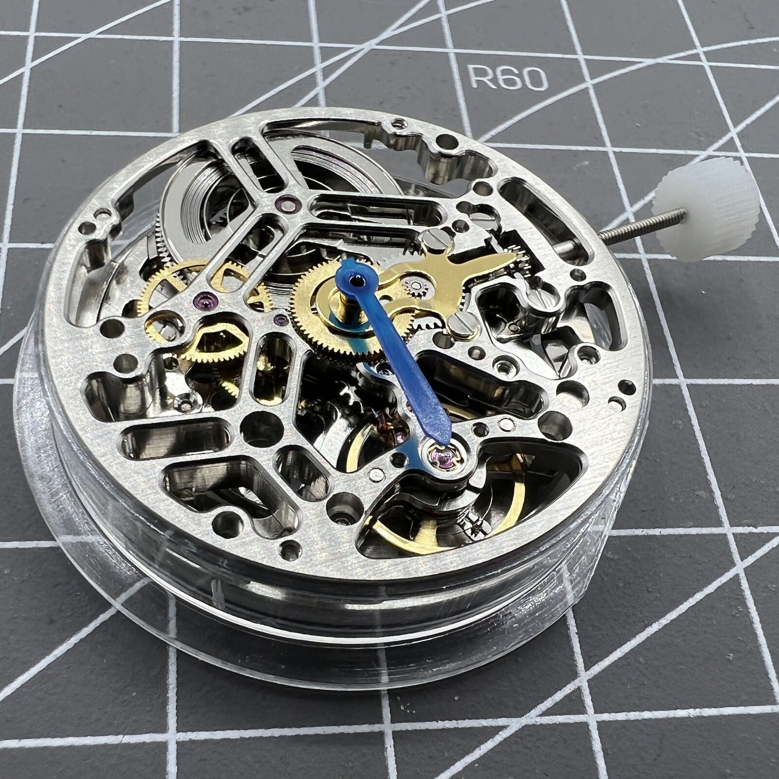 Asian HZ75DOA silver hollow balance wheel displaying intricate automatic mechanical watch movement for enthusiasts.