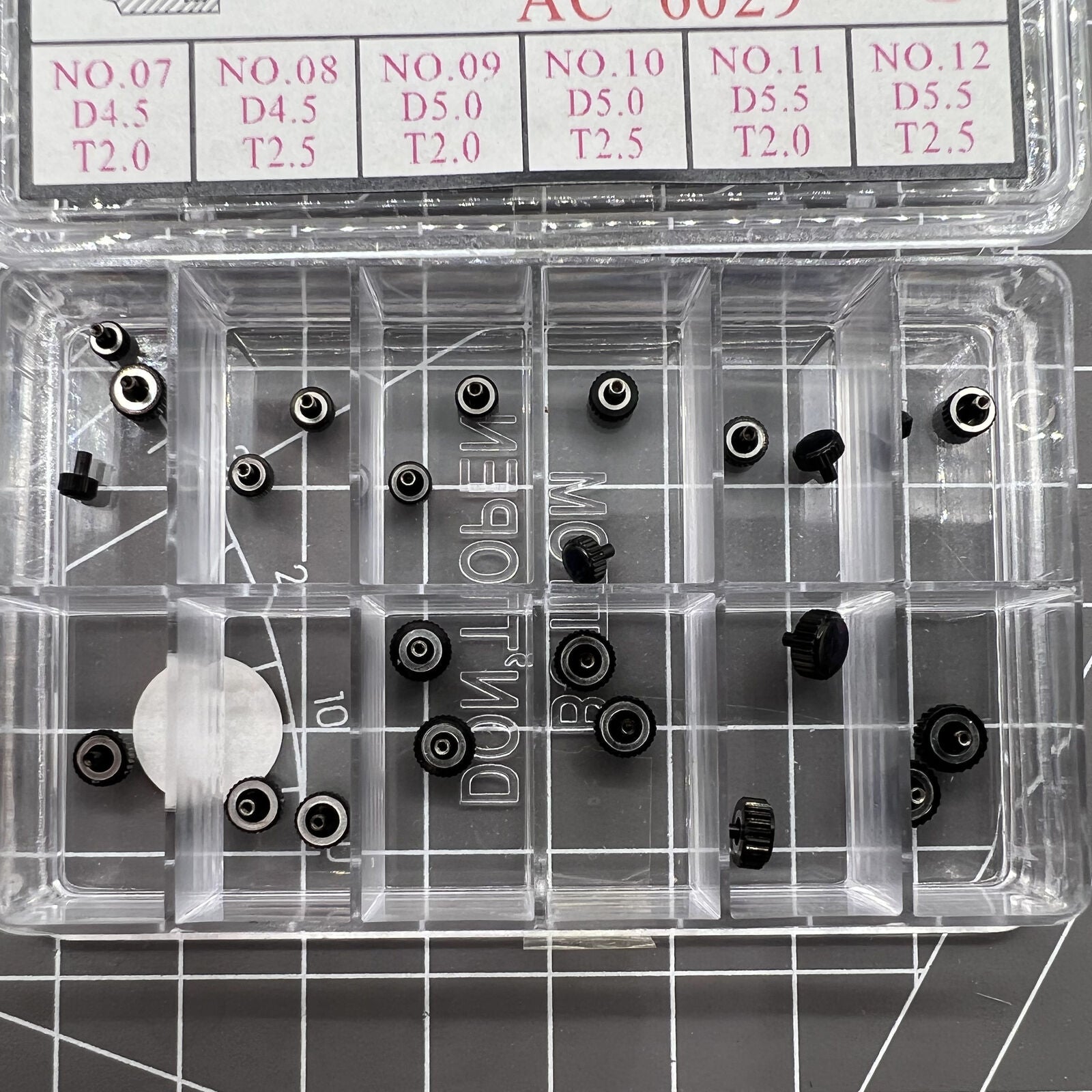 Black plated stainless steel watch crowns, 24 pieces in 12 sizes for precise watch repair and customization.