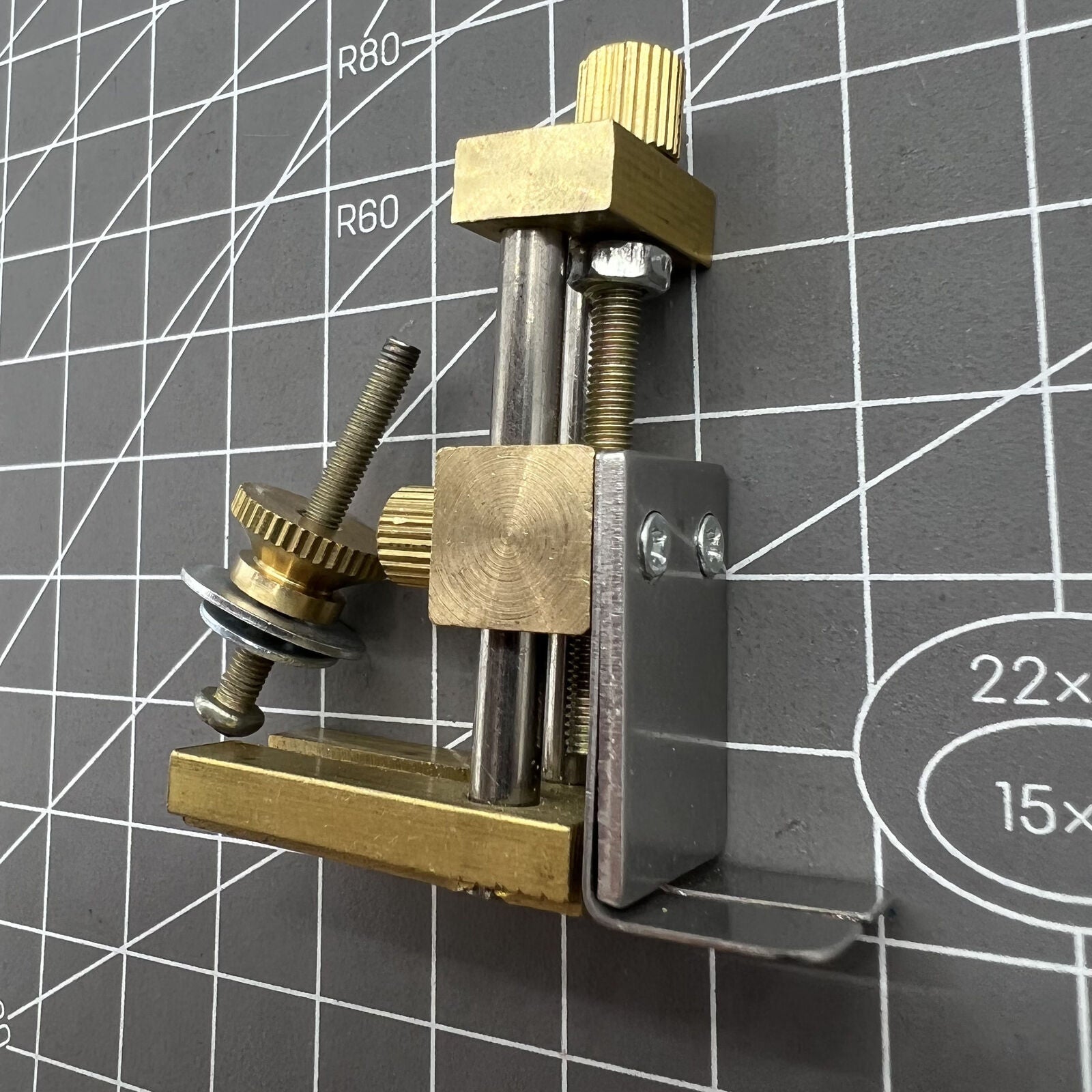 Auxiliary positioning tool for accurate watch stem cutting with cutter plier accessory.