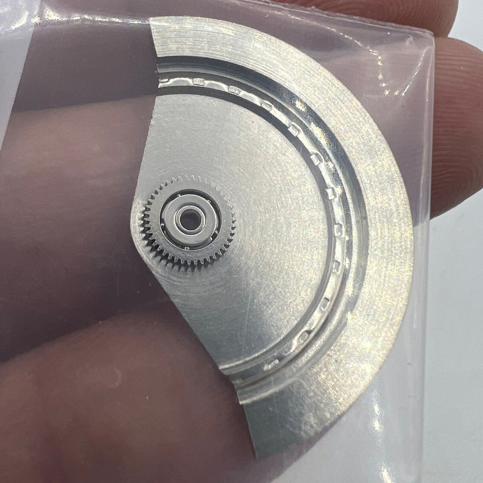 ETA Ref.570 rotor oscillating weight for automatic watch movements, precision spare part for repairs and maintenance.