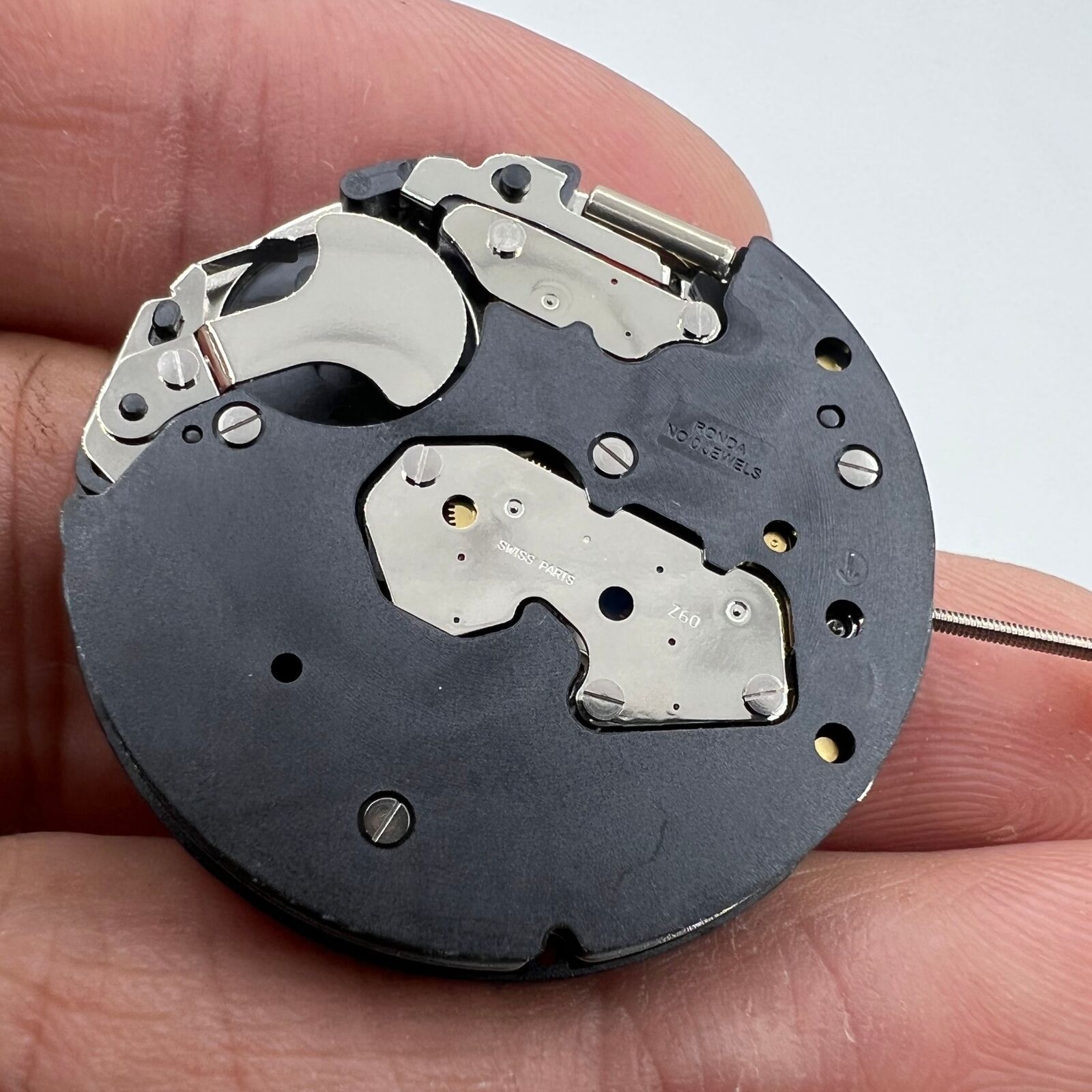 Ronda Z60 Swiss quartz watch movement with small second hand at 6 o'clock, precision craftsmanship by Ronda.