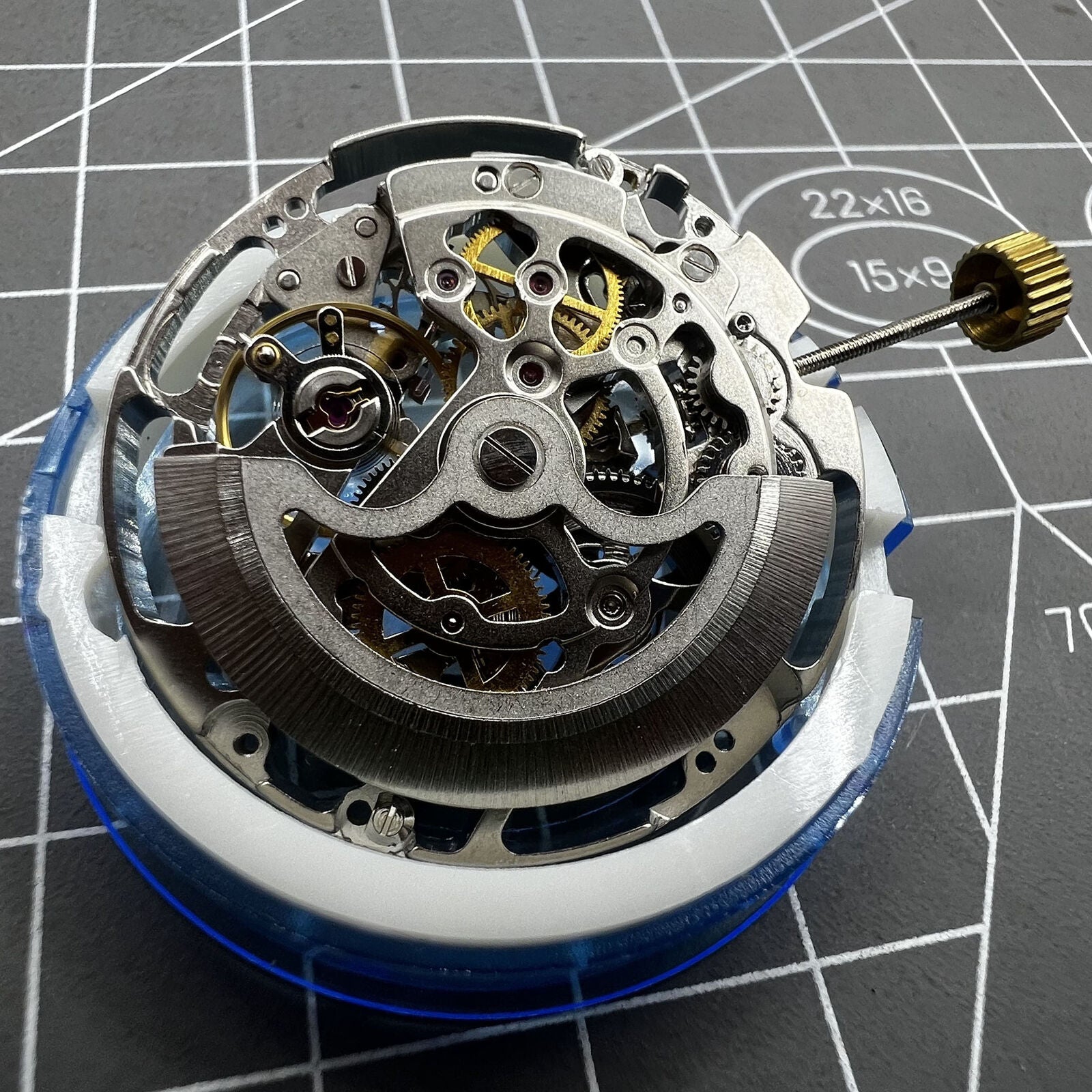Dandong Silver hollow automatic mechanical watch accessory highlighting second stop function for precision timekeeping.