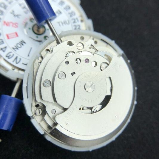 Epson YN56 mechanical watch movement with date and day display for precise timekeeping.