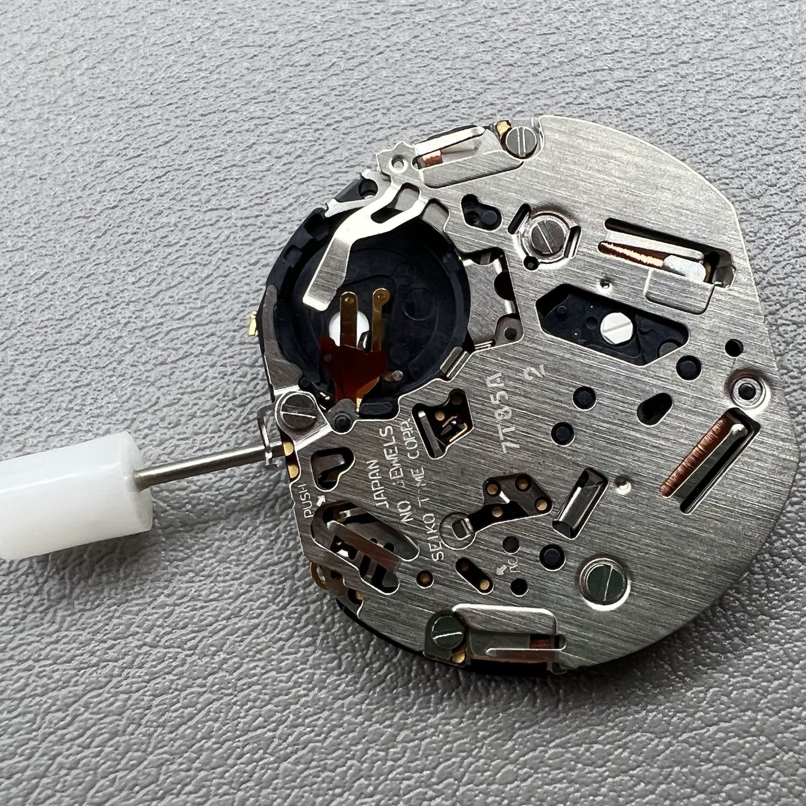 Seiko 7T85A quartz watch movement with precise chronograph functionality, ideal for accurate timekeeping.