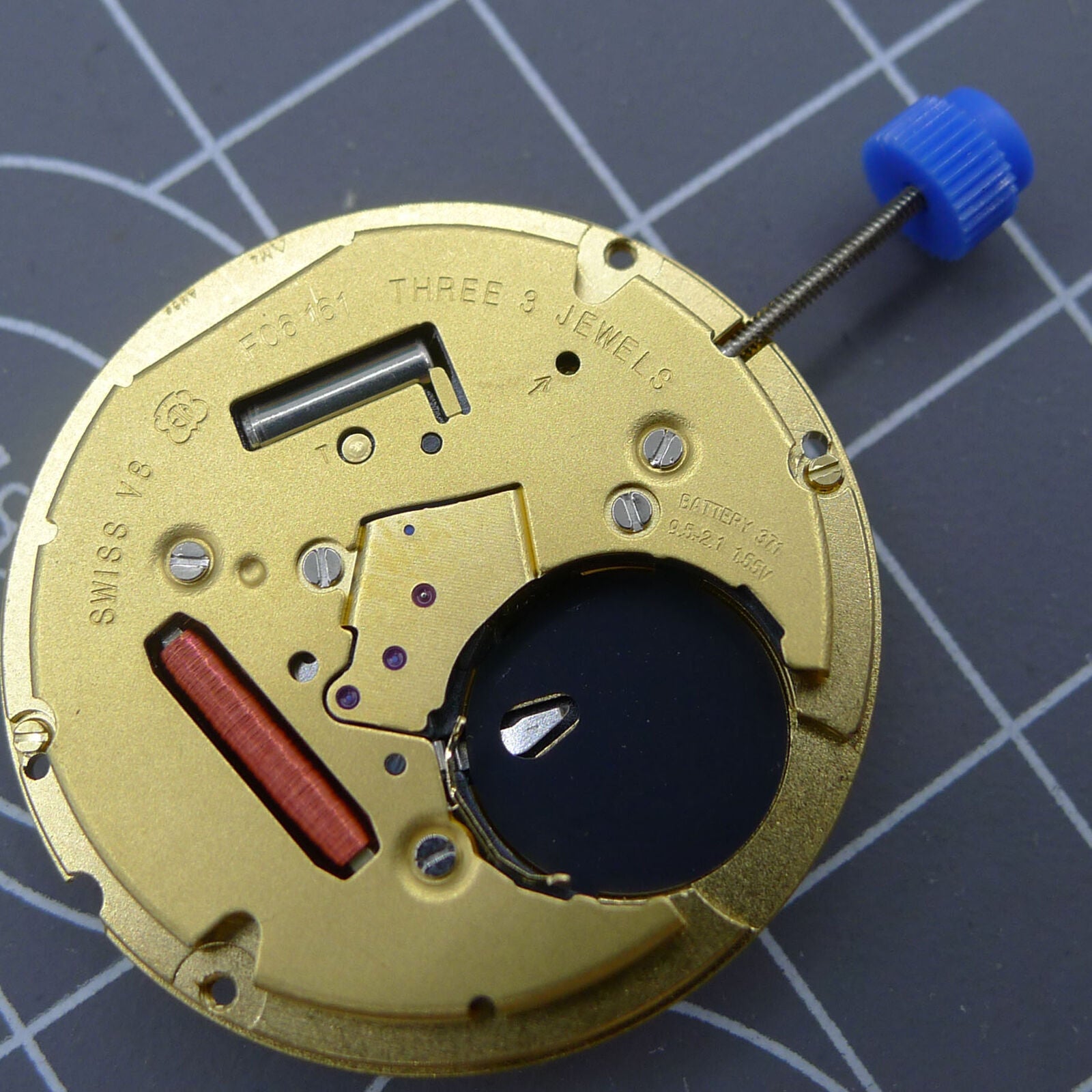 Swiss ETA F06.161 quartz watch movement with white dial, 3 hands, and date display at 6 o?clock by ETA.